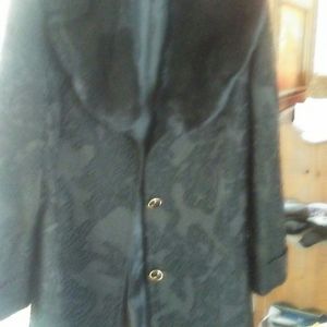 Black jacket with designs on it